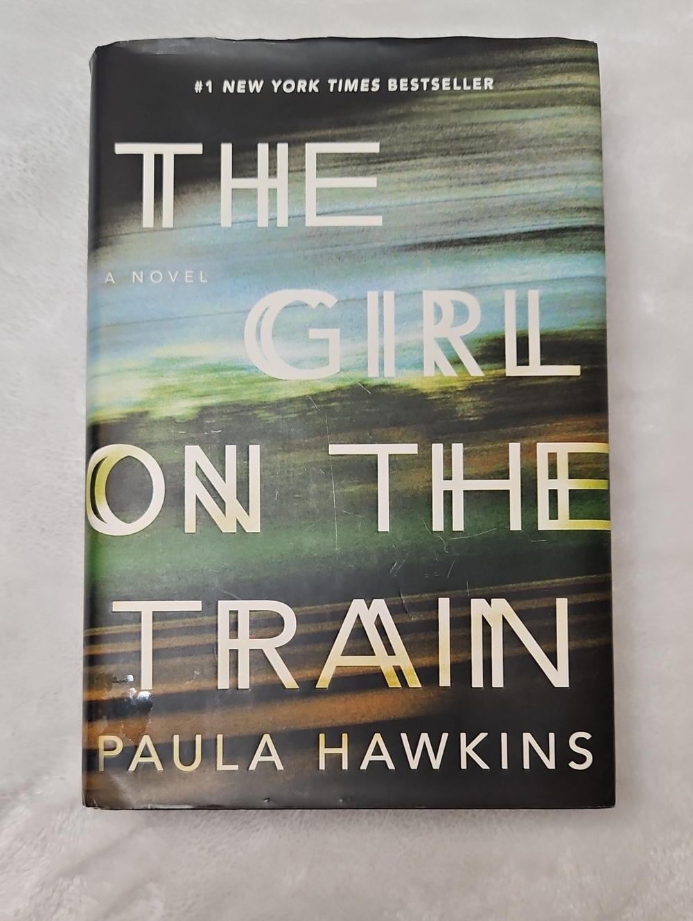The Girl on the Train by Paula Hawkins Hardcover Book